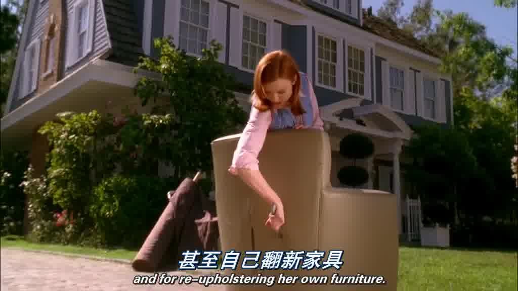 BREE, using a hand knife to slice open the cover of a stuffed chair.jpg