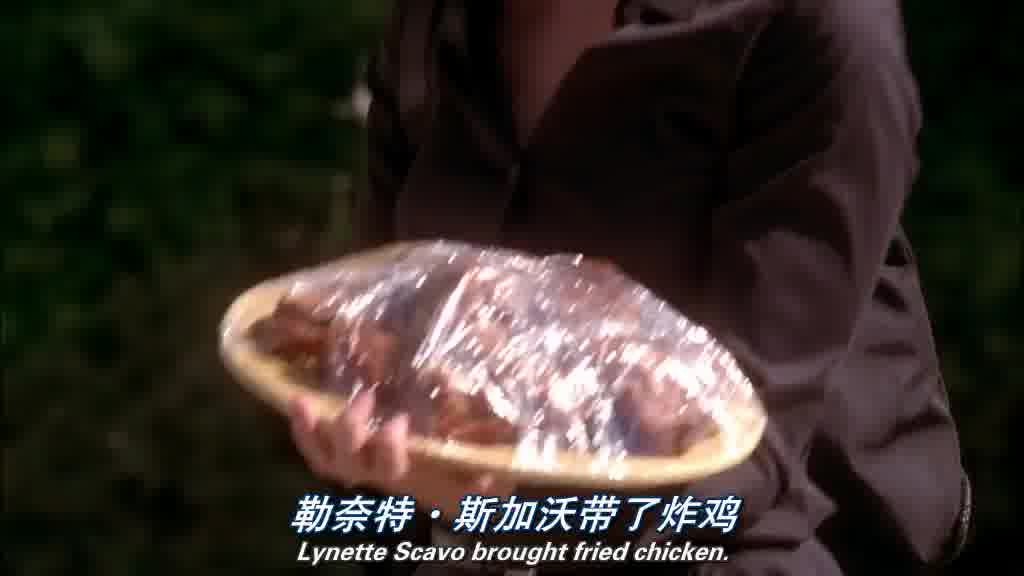 LYNETTE, holding a plate of fried chicken with one hand as she walks.jpg