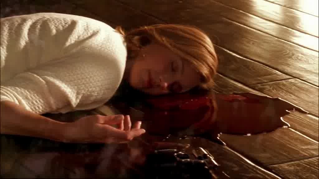MARY ALICE's dead body lying on the ground, a pool of blood next to her.jpg
