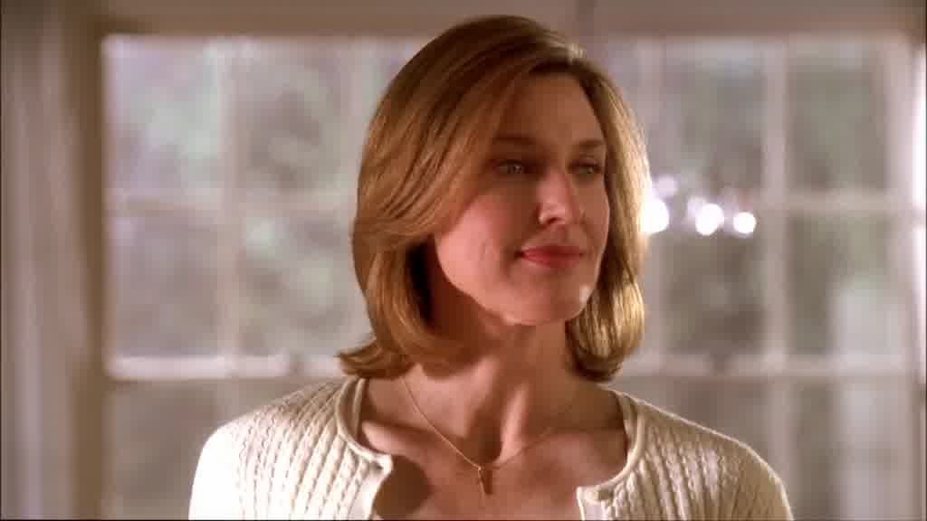 She sighs with satisfaction, a contented smile on her face.jpg