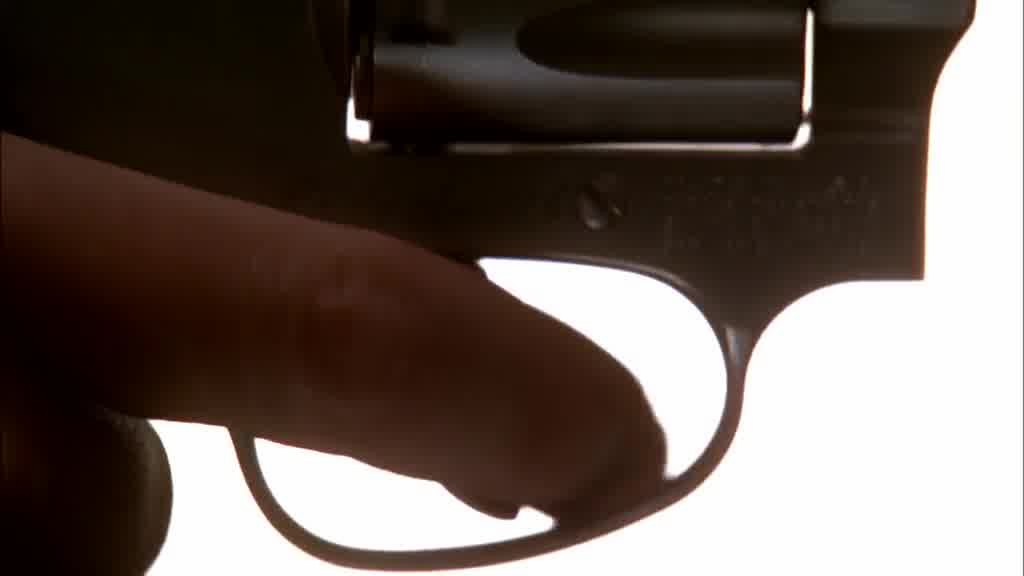 We see a finger pulling the trigger.jpg