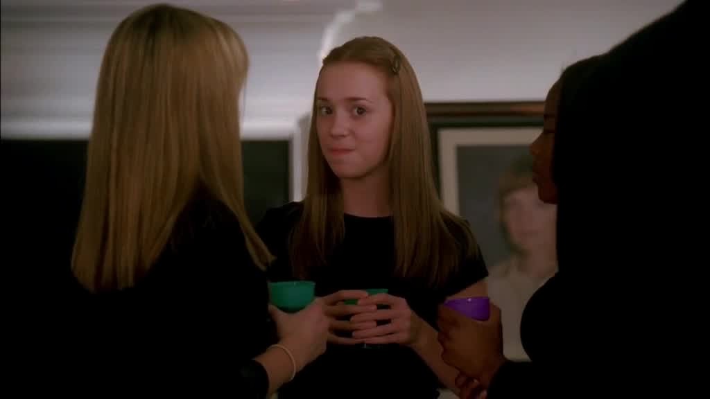 JULIE looks over to see SUSAN and MIKE flirting with each other, smiles.jpg