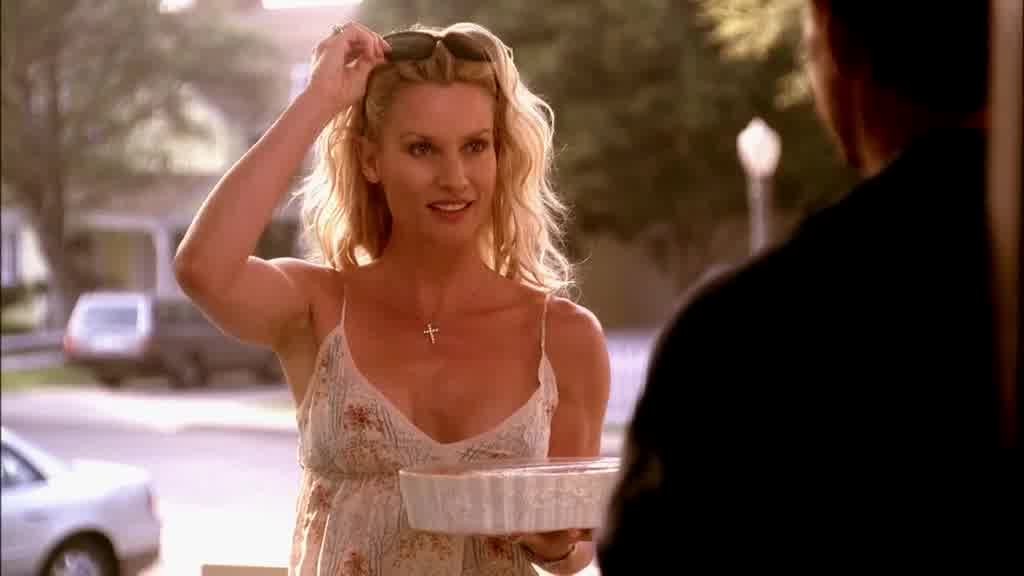 EDIE walks up to the porch, pushing her sunglasses onto her head.jpg