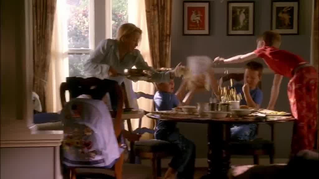 LYNETTE struggles with her kids in her home, as the boys throw cereal around.jpg