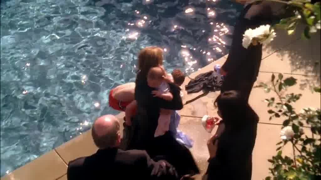 LYNETTE takes the baby from the man, then goes up to PAUL, flustered, as the boy.jpg