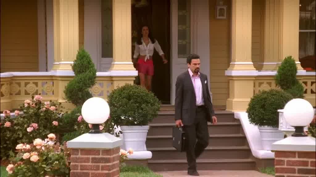 GABRIELLE walks out the front door and walks down the porch steps.jpg