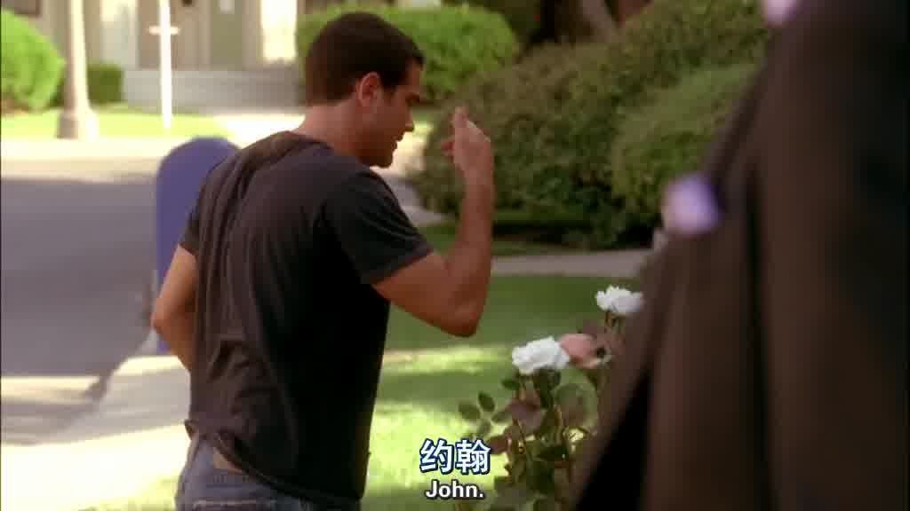JOHN is cutting a bush with a pair of gardening shears.jpg