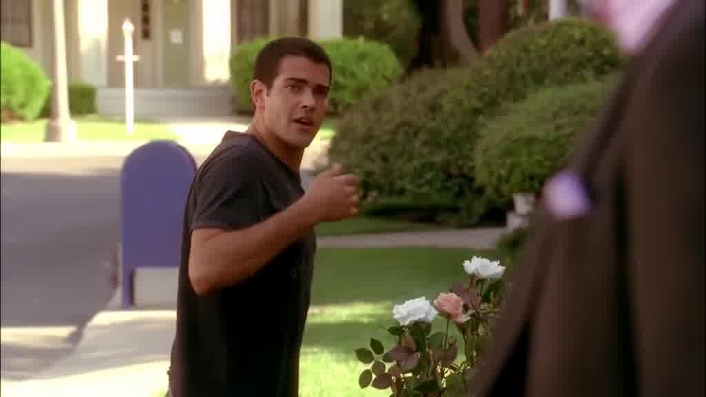 John pricks his finger on a rose thorn.jpg