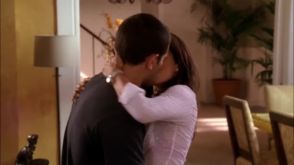 She puts her arms around his neck, kissing him as she sliding her hands up his back.jpg