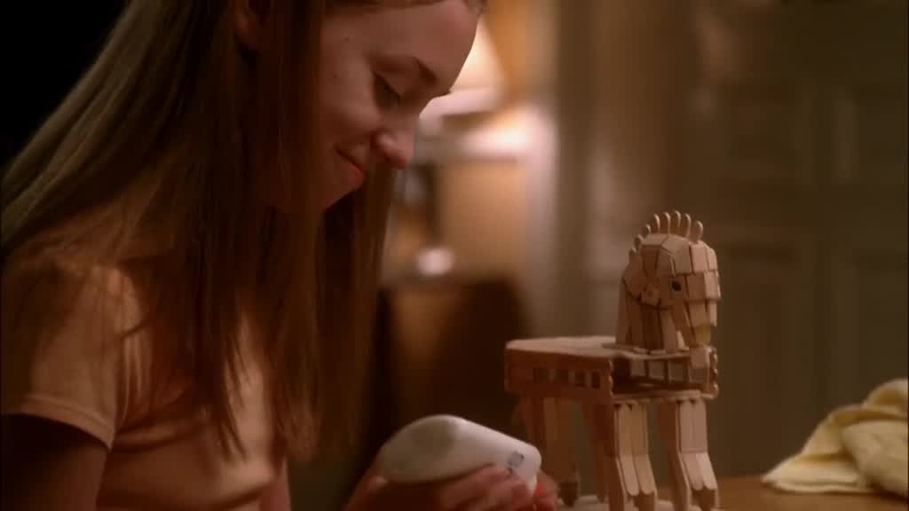 JULIE smiles, looking back down at her project.jpg