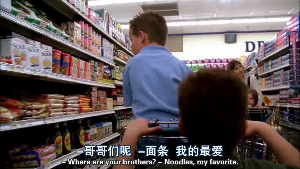 PARKER is pushing PORTER on the shopping cart in another aisle.jpg