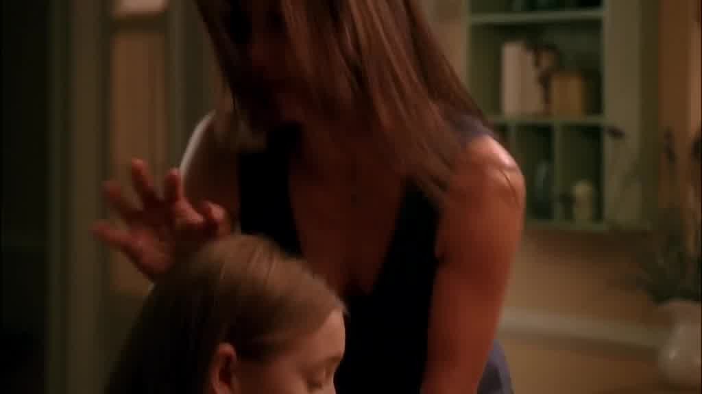 SUSAN kisses JULIE's hair, then opens the kitchen back door to walk outside.jpg