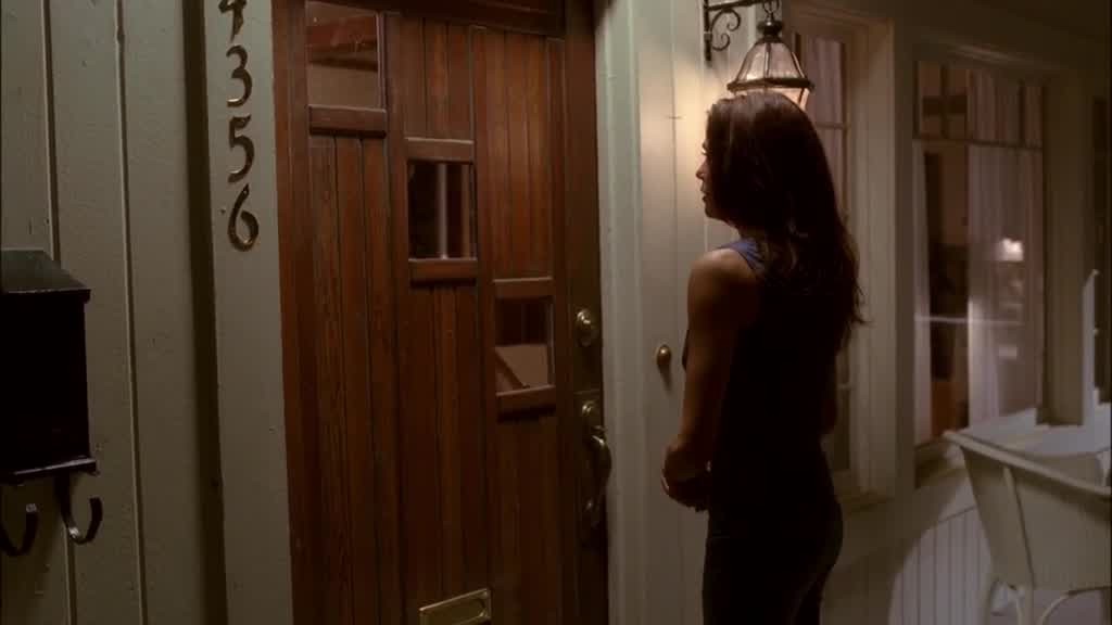 SUSAN walks up the steps and rings MIKE's doorbell.jpg