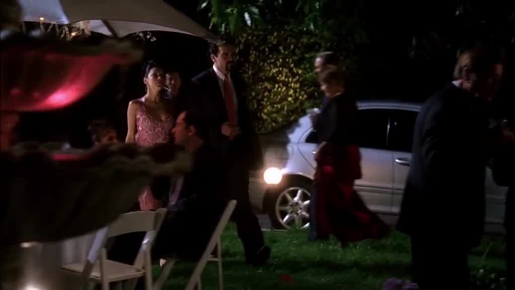 CARLOS walks with GABRIELLE on his arm.jpg