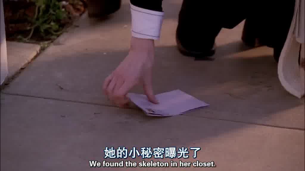A piece of paper falls onto the ground.jpg