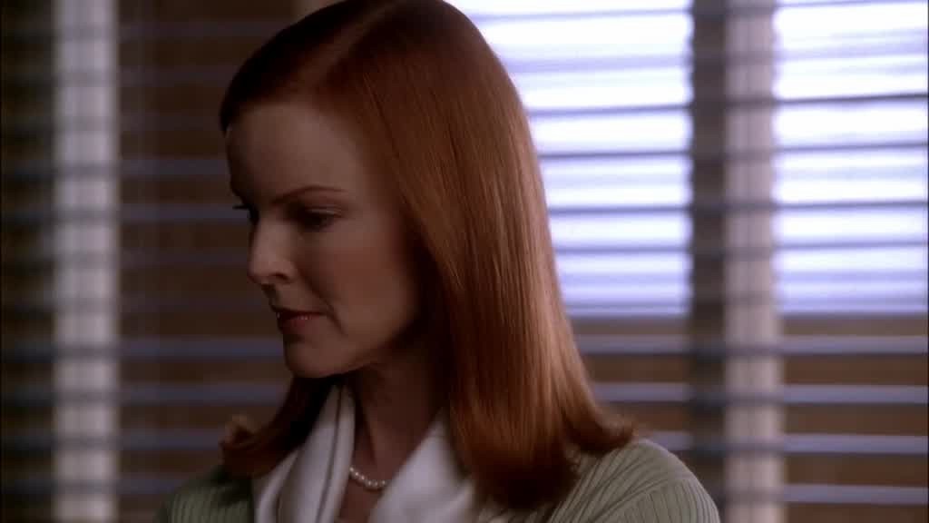 BREE looks down in at her lap, upset.jpg