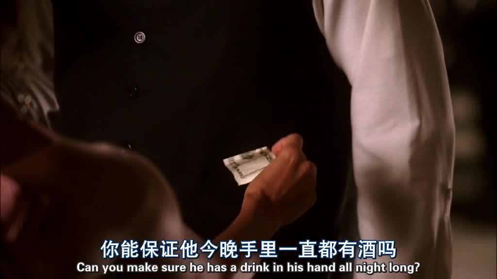 Gaby tucks a folded banknote in his pocket.jpg