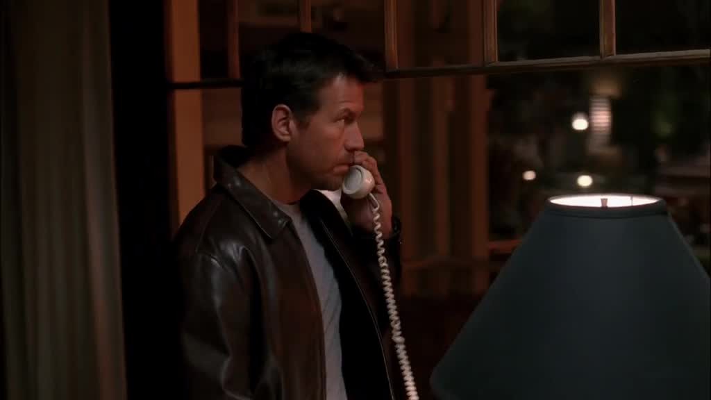 MIKE picks up the phone and dials.jpg