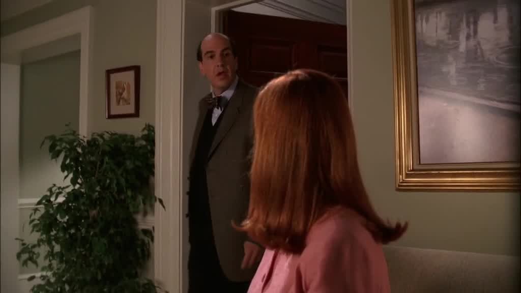BREE is sitting in the waiting room of DR. GOLDFINE's office, turning as he.jpg