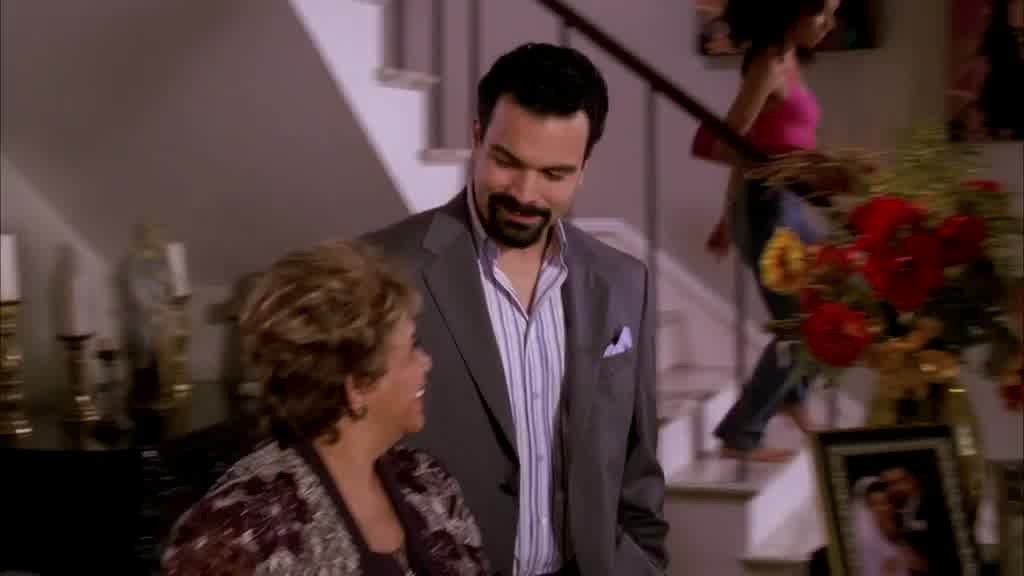 Carlos and his mother are talking to each other in Spanish.jpg