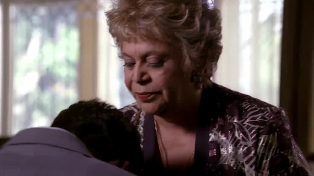 Mama Solis looks at him and gets up as if she's going to comfort her hurt child.jpg