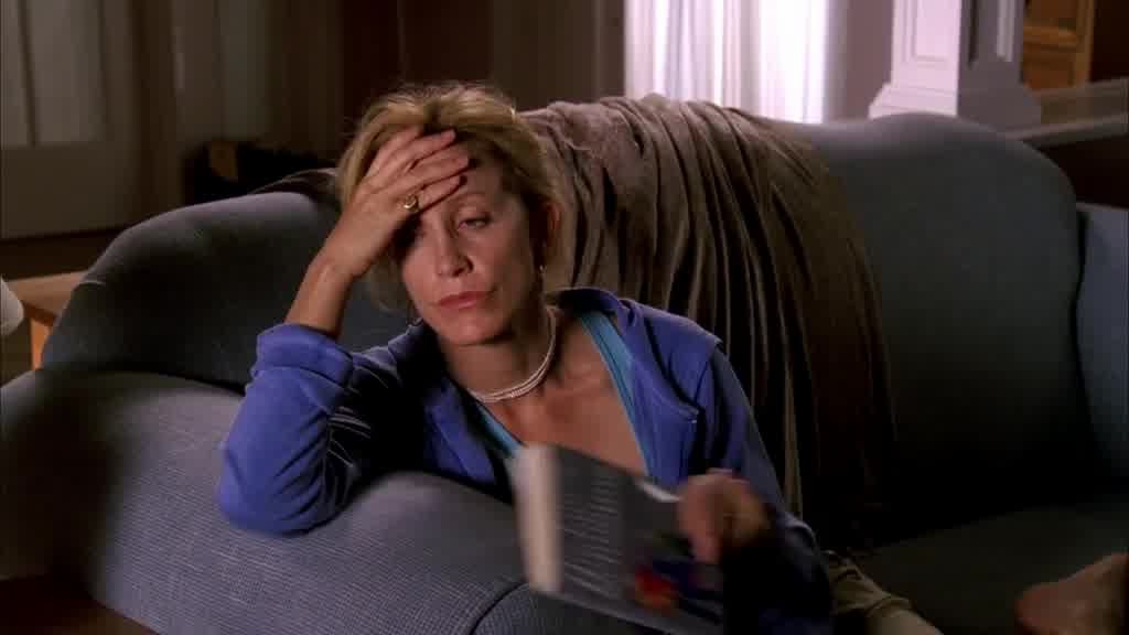 She gives up, throws the book down and leans back on the sofa.jpg