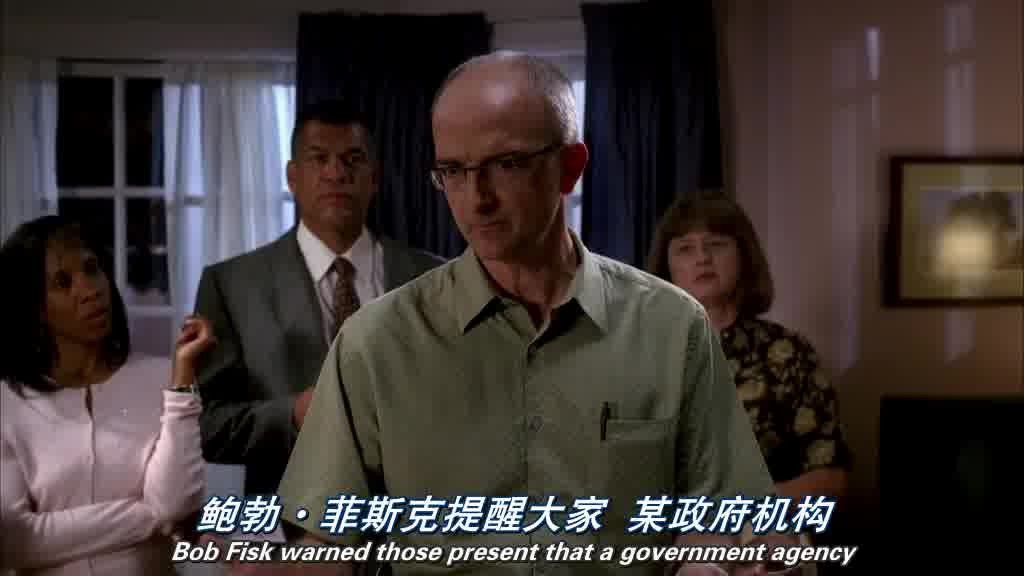 shot of a geeky looking man talking to the gathered crowd.jpg