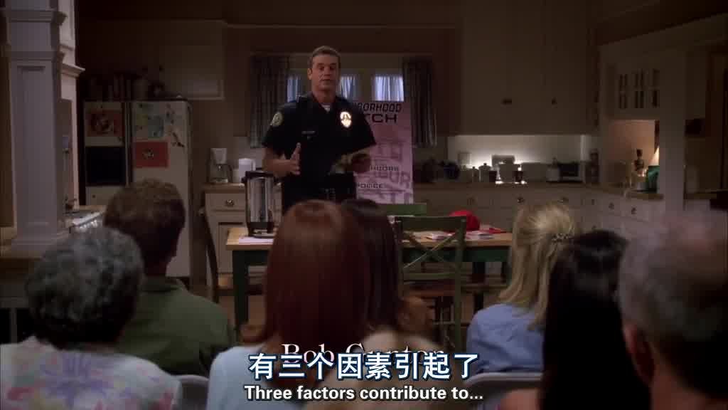 Shot of a policeman giving a presentation to the assembled people, who are all w.jpg
