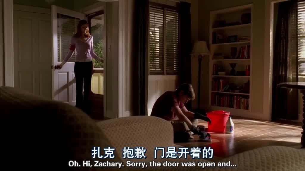 The door is open, so she enters and sees Zach sitting on the floor with his back.jpg