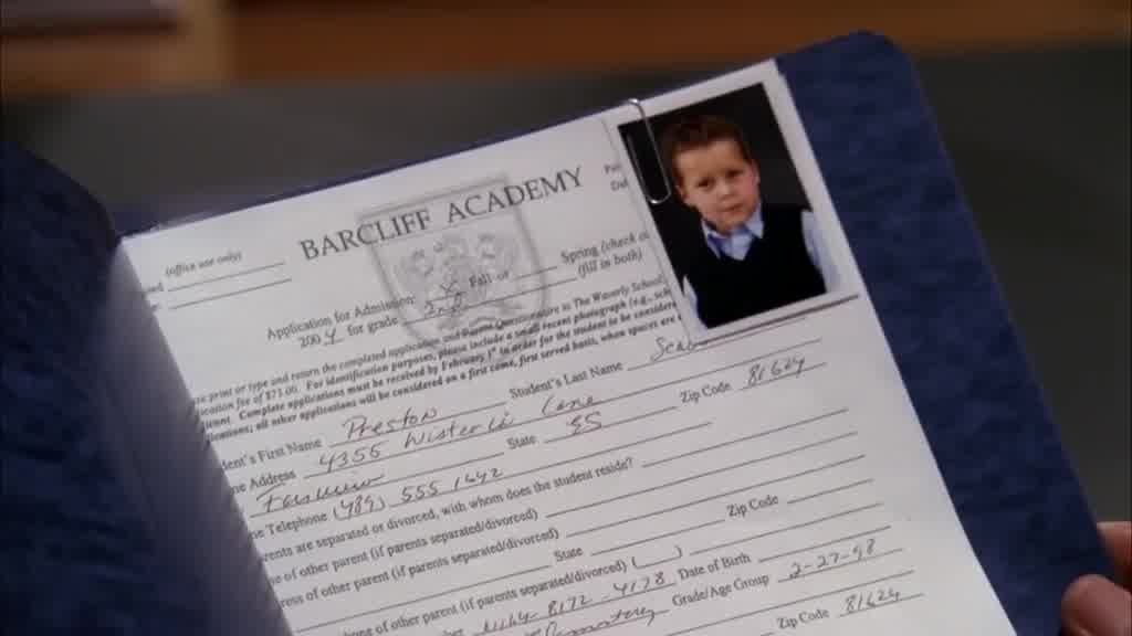The folder is opened to reveal Preston's application form for the school.jpg