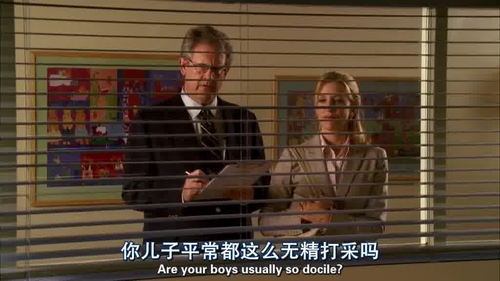 The headmaster and Lynette stand outside the room the boys are in watching them.jpg