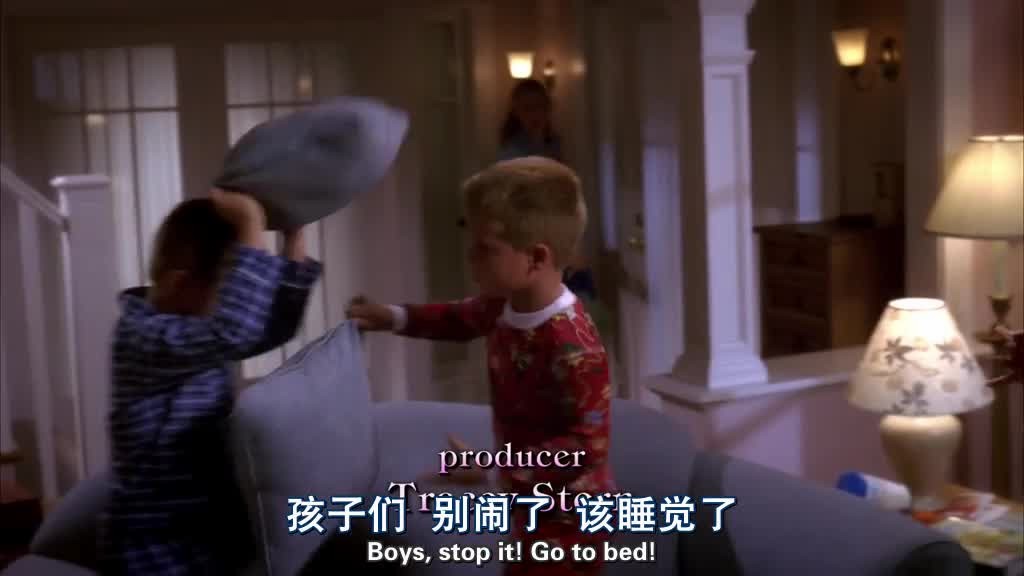The twins are jumping on the sofa, having a pillow fight.jpg