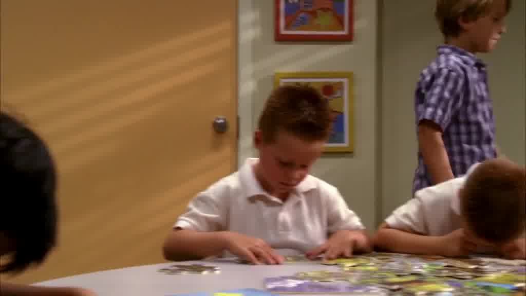 They're both sitting quietly at a table.jpg