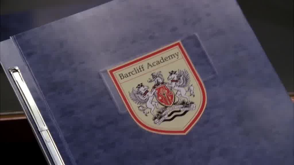 We see a folder with a posh crest on it.jpg
