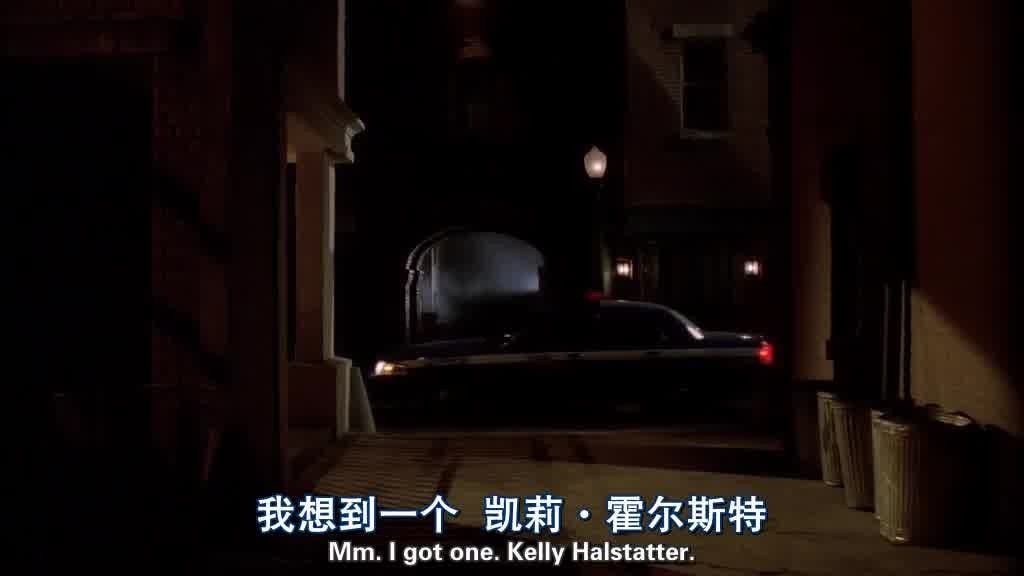 We see a police car drive past an alley.jpg