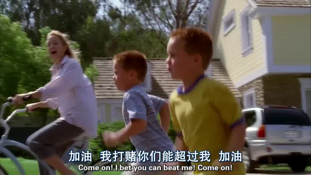 We see them racing down the street and Lynette rides past them on a bike.jpg