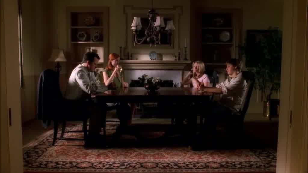 Bree, Rex, Andrew, and Danielle sit at the dining room table.jpg