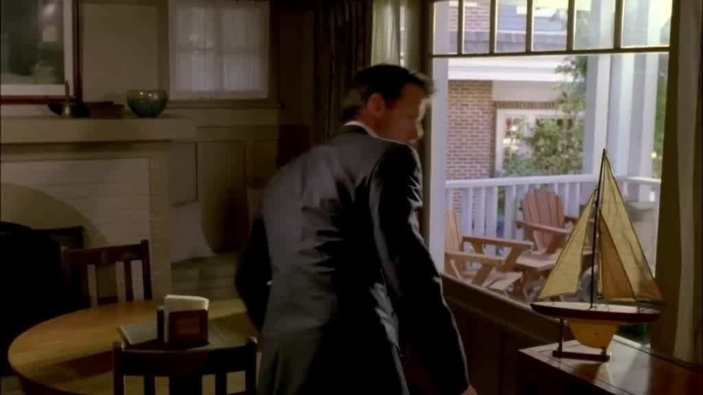 He hears a knock on his front door, so he grabs his keys and opens the door.jpg