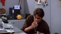 S01E03 He types for a little while, opens the drawer again,and takes another drag of the cigarette
