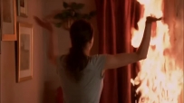 S01E01 She throws the leftover wine from the glasses onto the fire, which makes it worse